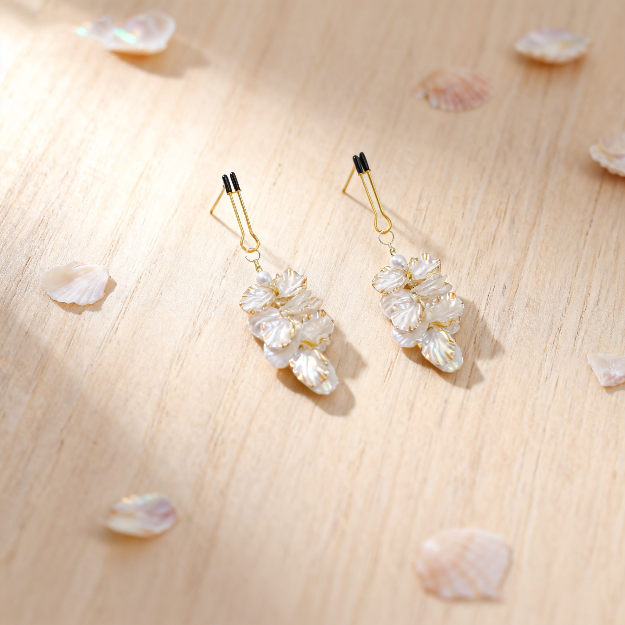 Petal Cascade clips styled with pale petals on a light wood surface